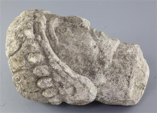 A 12th century Norman limestone head of a man or saint, height 11.75in.